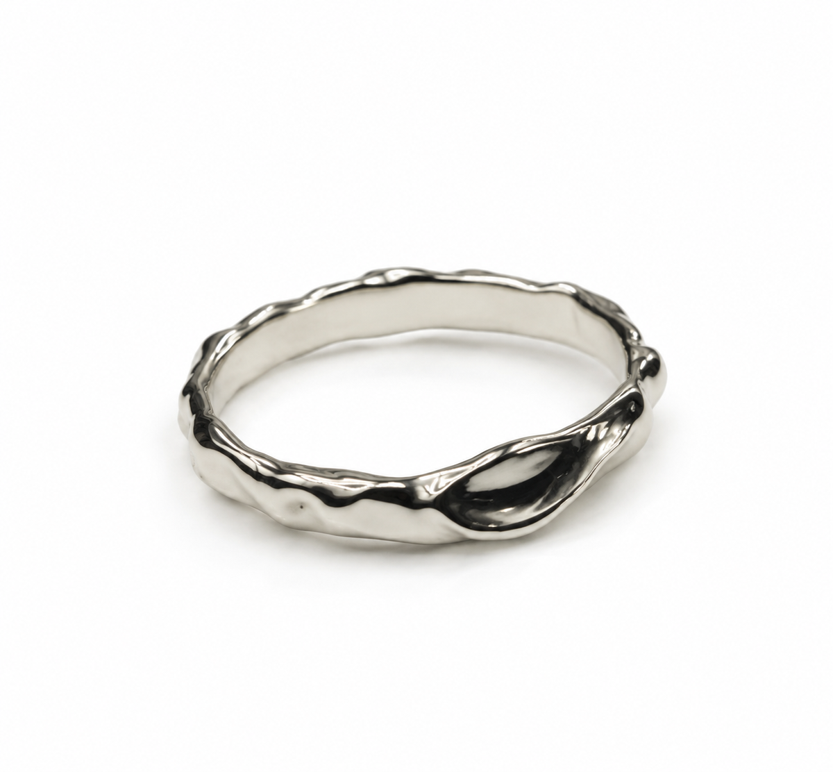 A polished silver ring with an organic, wavy, textured outer edge, shown on a plain light gray background.