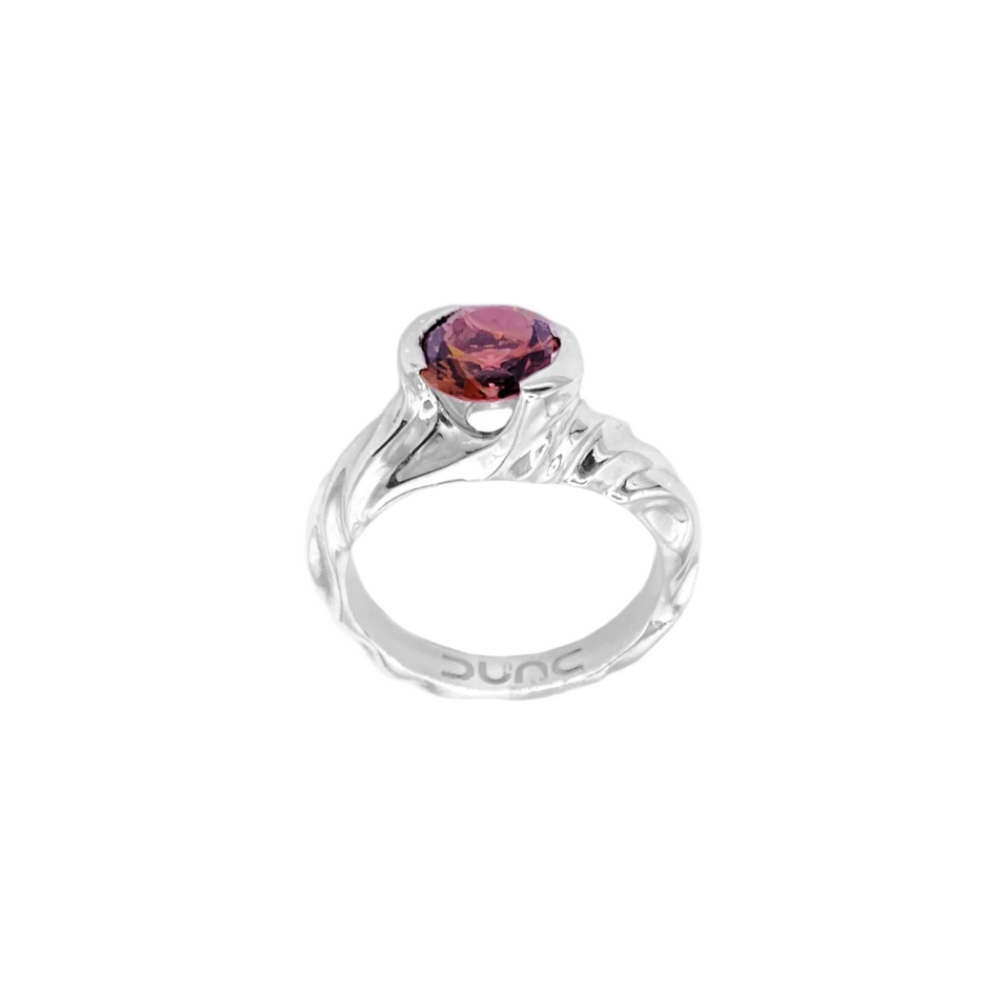 A 925 sterling silver ring with a rhodium finish, featuring a round cut peach tourmaline centerpiece in a half bezel setting.