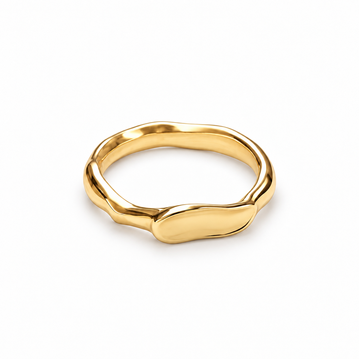A polished gold ring with an organic, wavy, fluid silhouette, photographed on a clean white background.