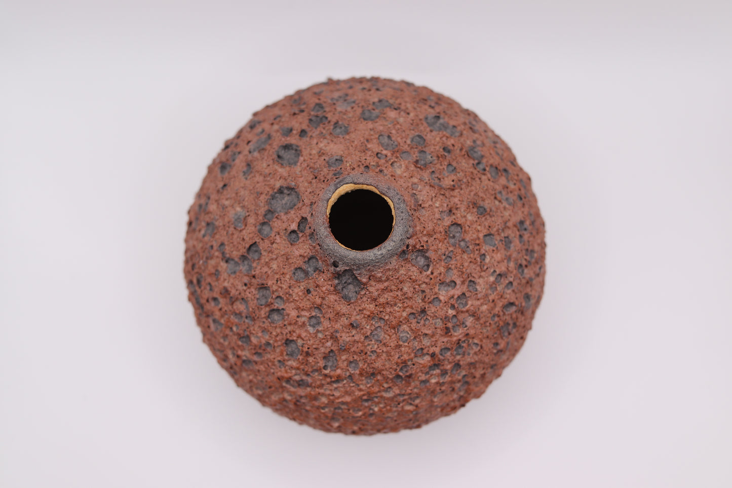 Round abrasive disc with a central hole on a white background