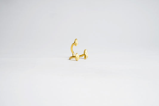 Gold ring on a light gray background