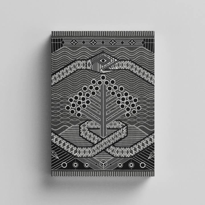 A rectangular product with a black and white geometric pattern, centered on a light gray background.