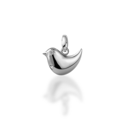 Silver bird-shaped pendant on a white background