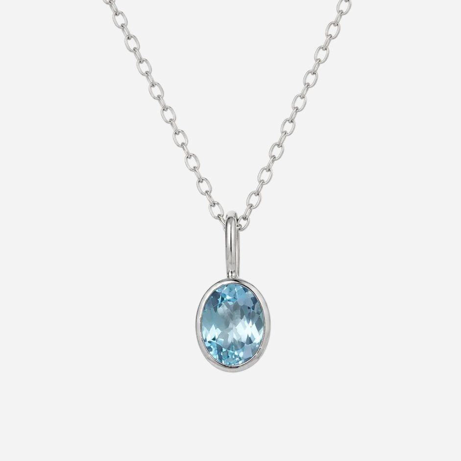A silver chain necklace with an oval-cut light blue gemstone pendant in a silver bezel setting, shown against a plain white background.
