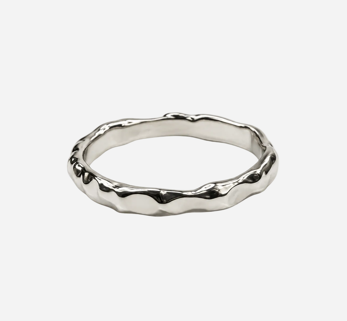 A polished white gold ring with an organic, wavy, textured outer edge, shown on a plain light gray background.