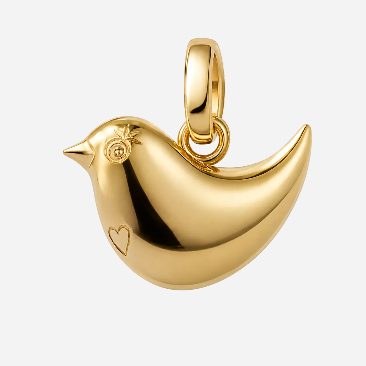 A polished gold bird-shaped pendant charm with a small heart engraving on its side, shown on a clean white background.