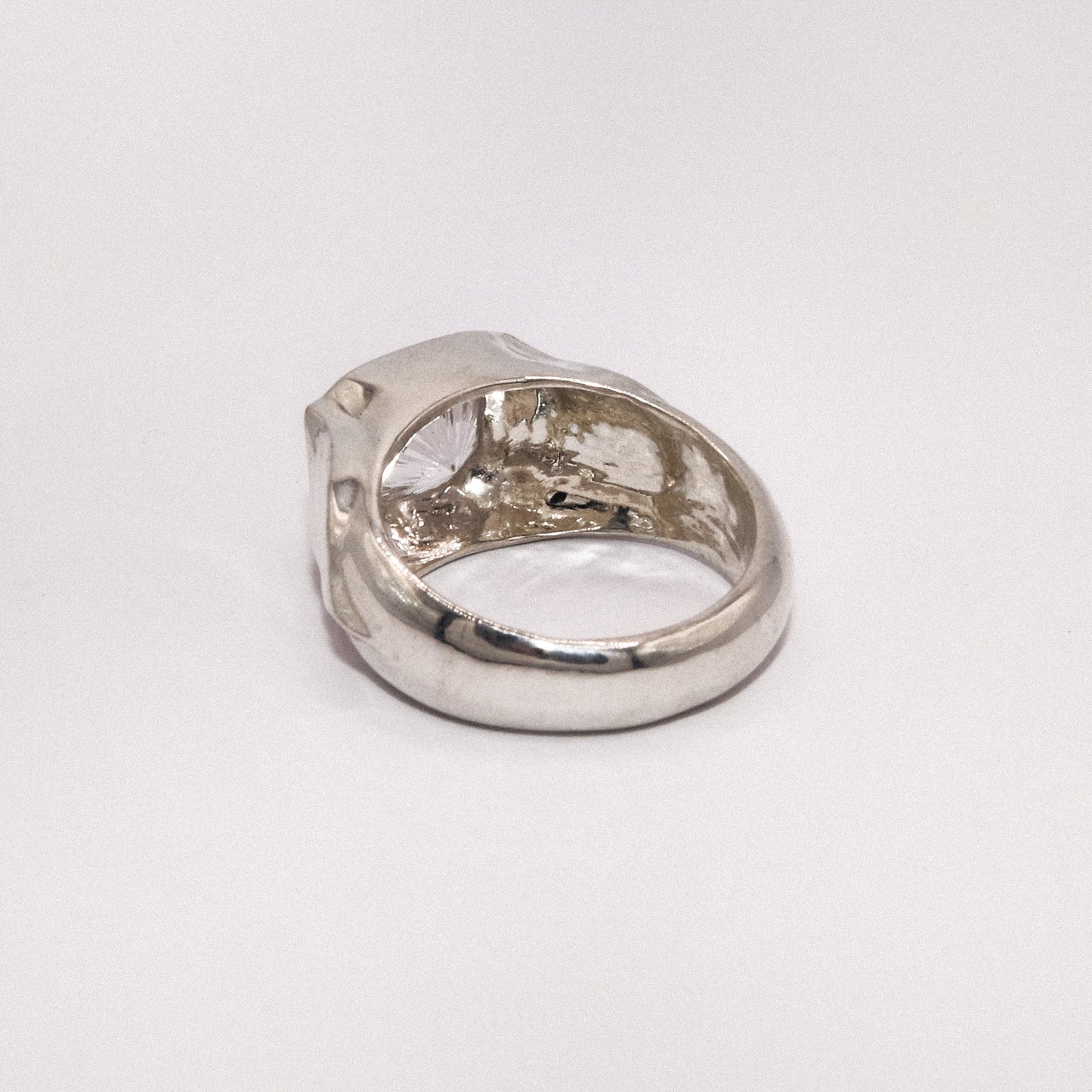 Silver ring on a white background