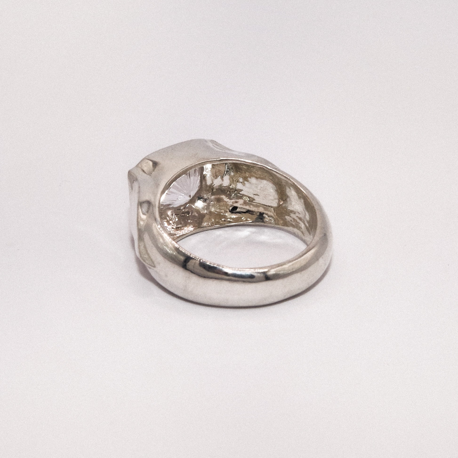 Silver ring on a white background