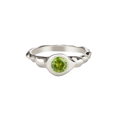 A demantoid garnet ring set in 14k white gold with a polished finish, featuring a round cut green gemstone.