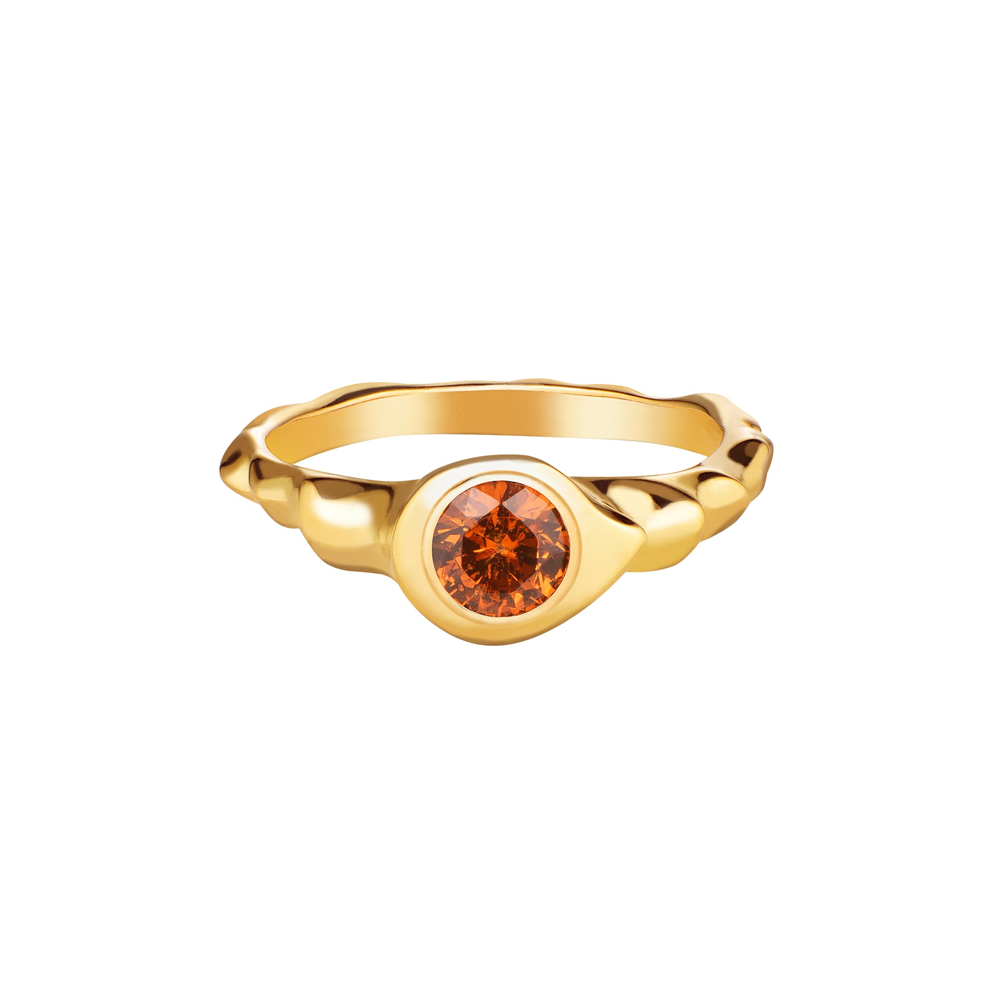 A round cut orange garnet stone set in a gold ring with a polished finish.