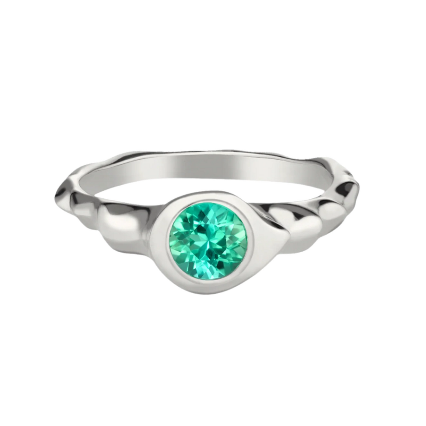 A silver rhodium-plated ring with a round cut green tourmaline stone in the center.