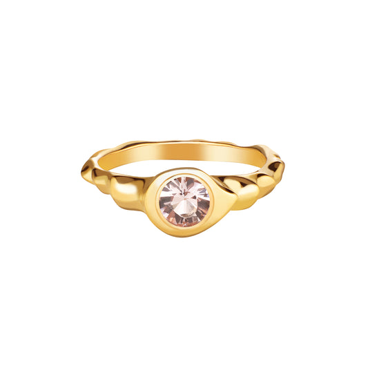A gold-colored ring featuring a centralmorganite gemstone, set in a simple yet elegant mounting.