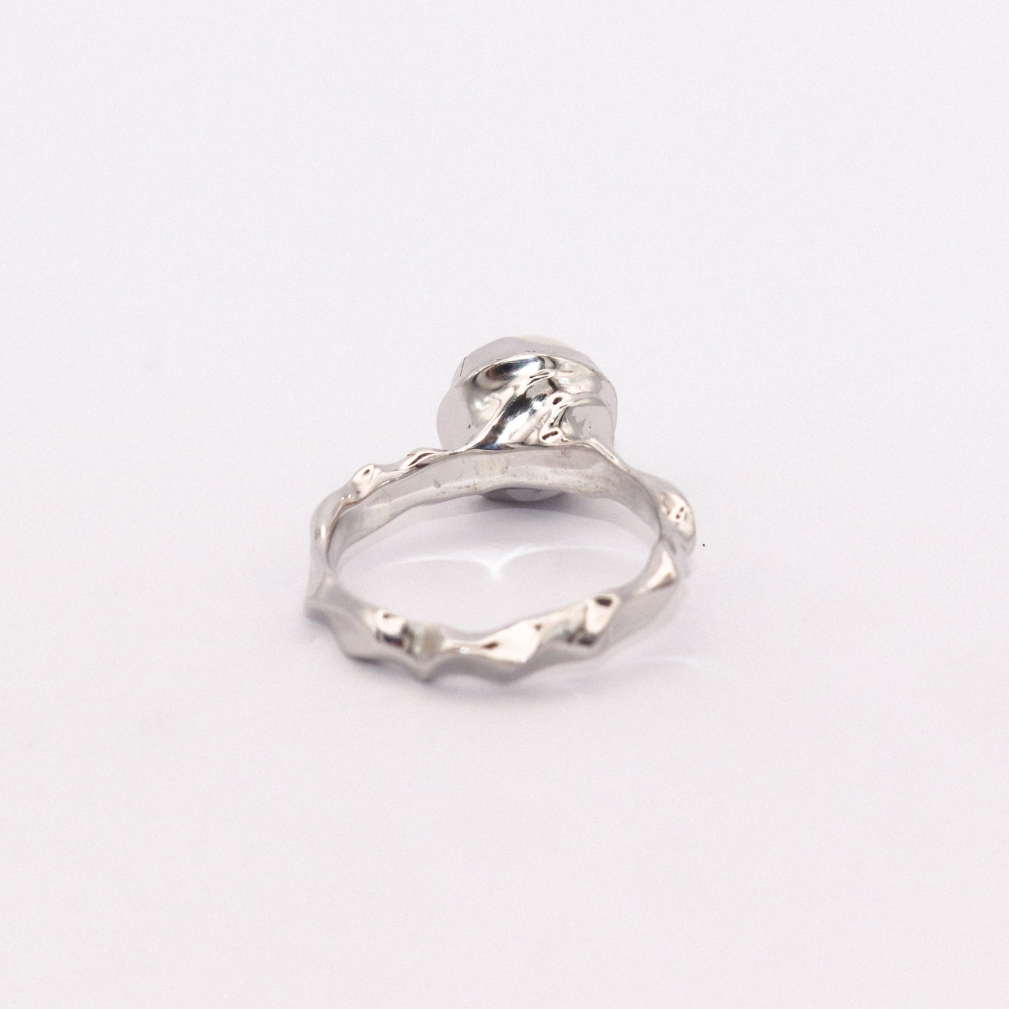 Silver ring on a white background