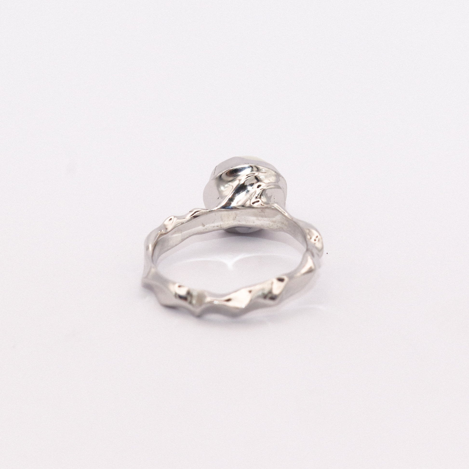 Silver ring on a white background