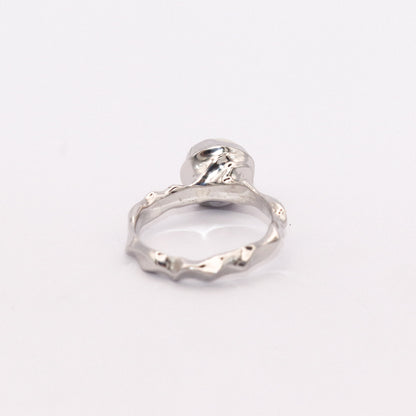 Silver ring on a white background