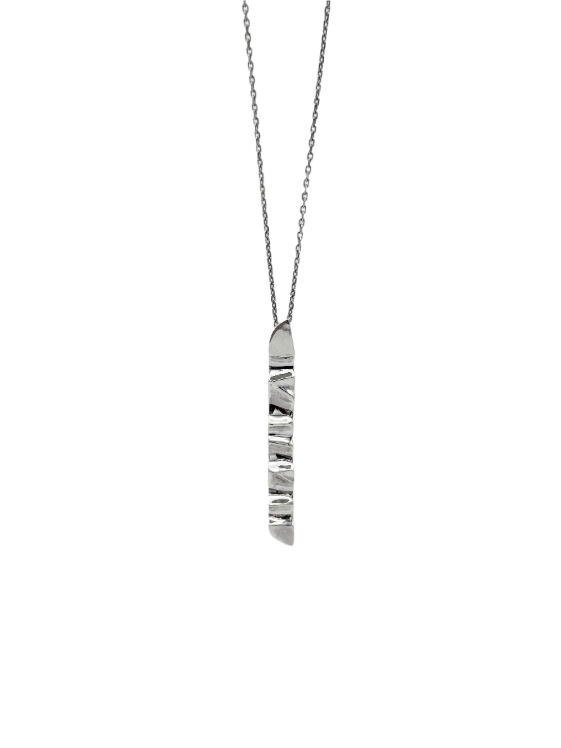 A sterling silver pendant with a wave design, suspended from a chain.