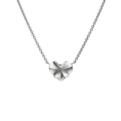 Silver heart-shaped pendant on a chain against a white background