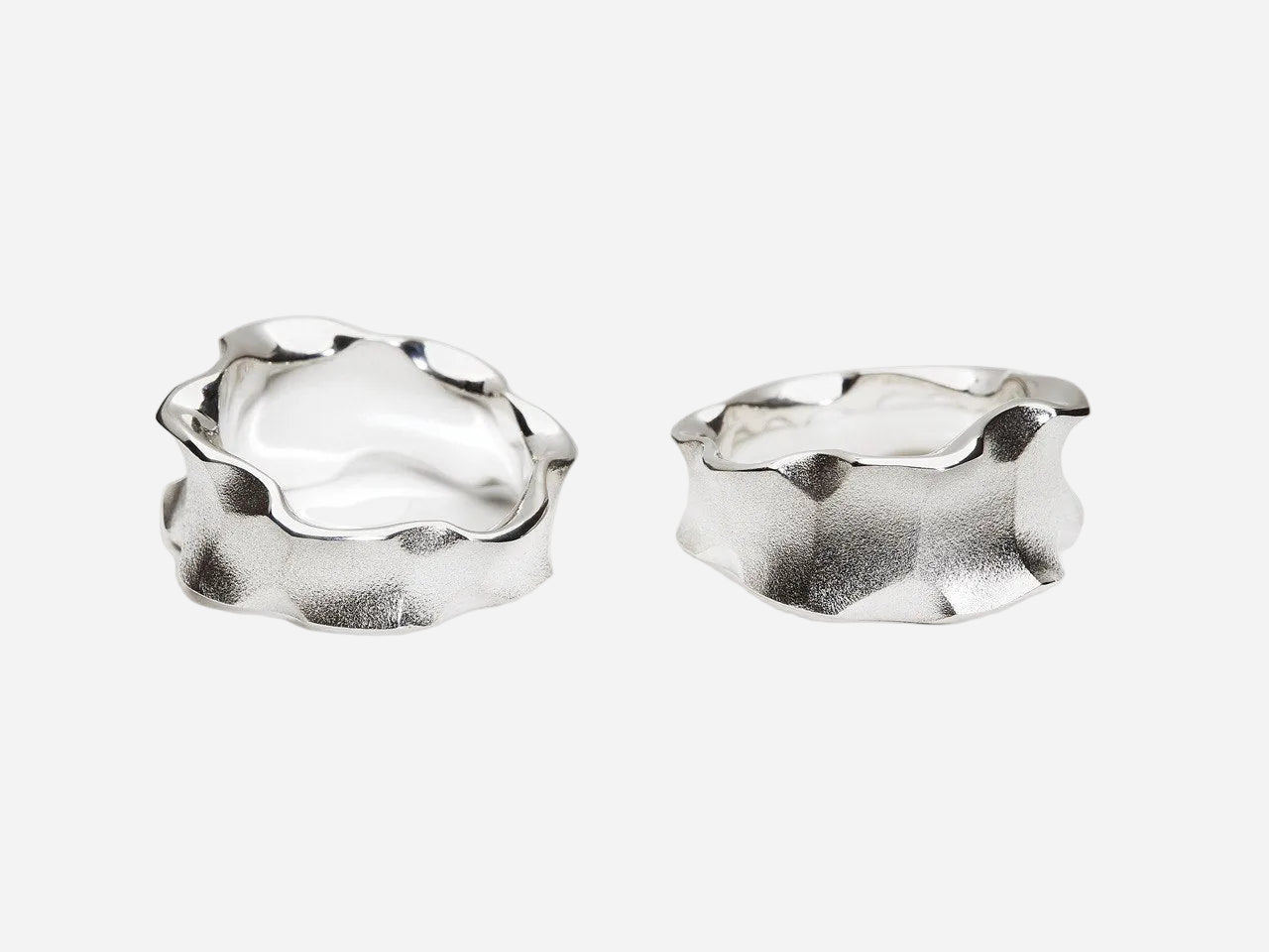 Two silver hoop earrings on a white background