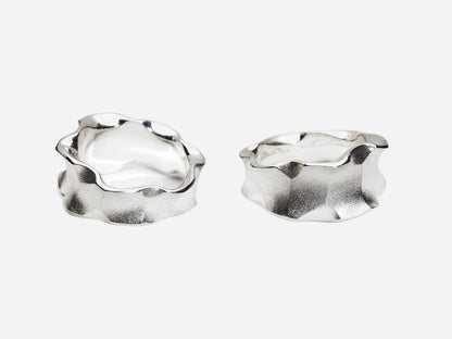 Two silver hoop earrings on a white background