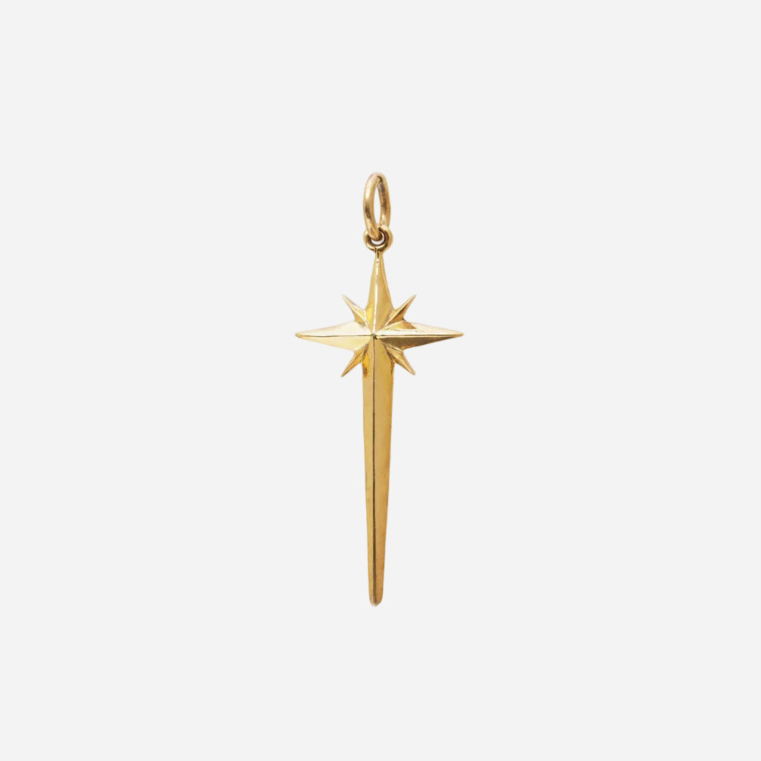 Gold star-shaped pendant on a white background