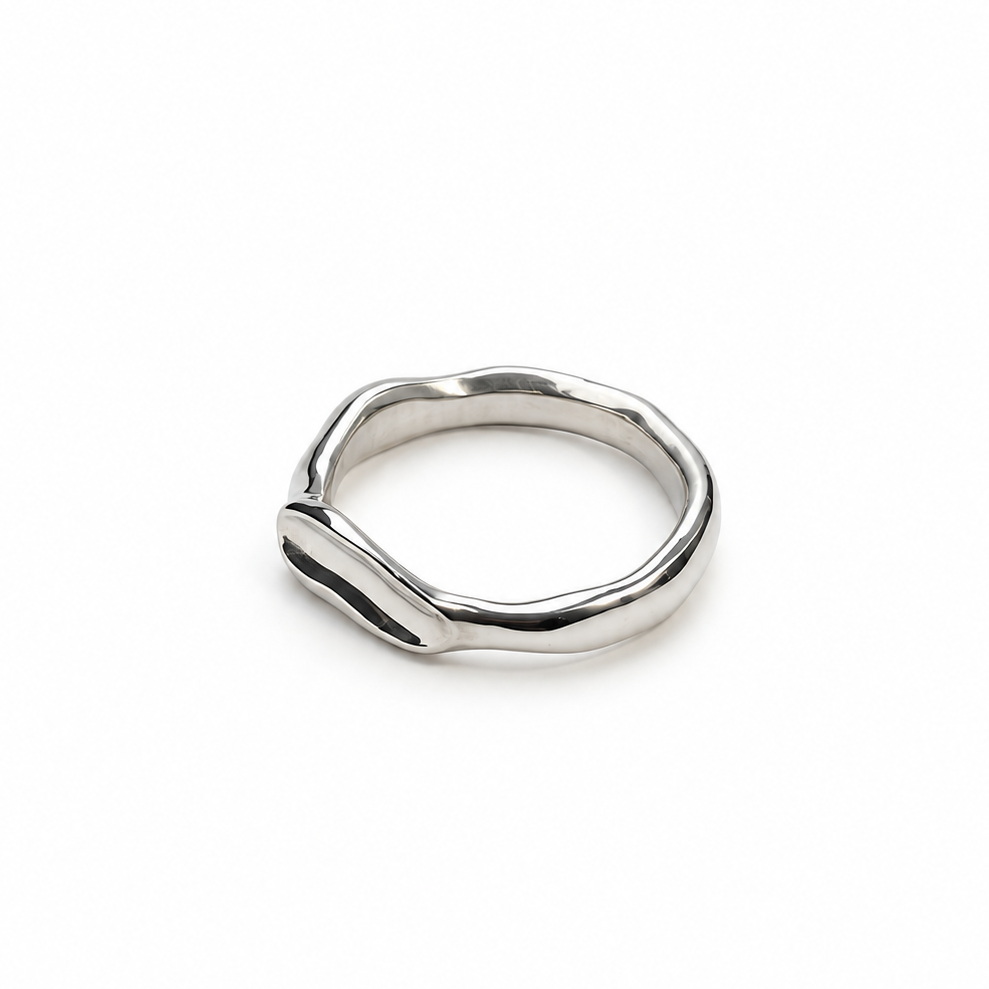 Ring with a flag design on a marble surface
