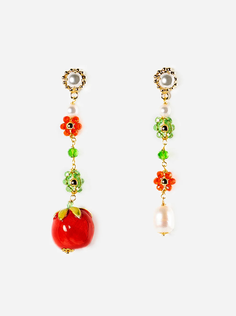 Pair of earrings with floral and fruit designs on a white background