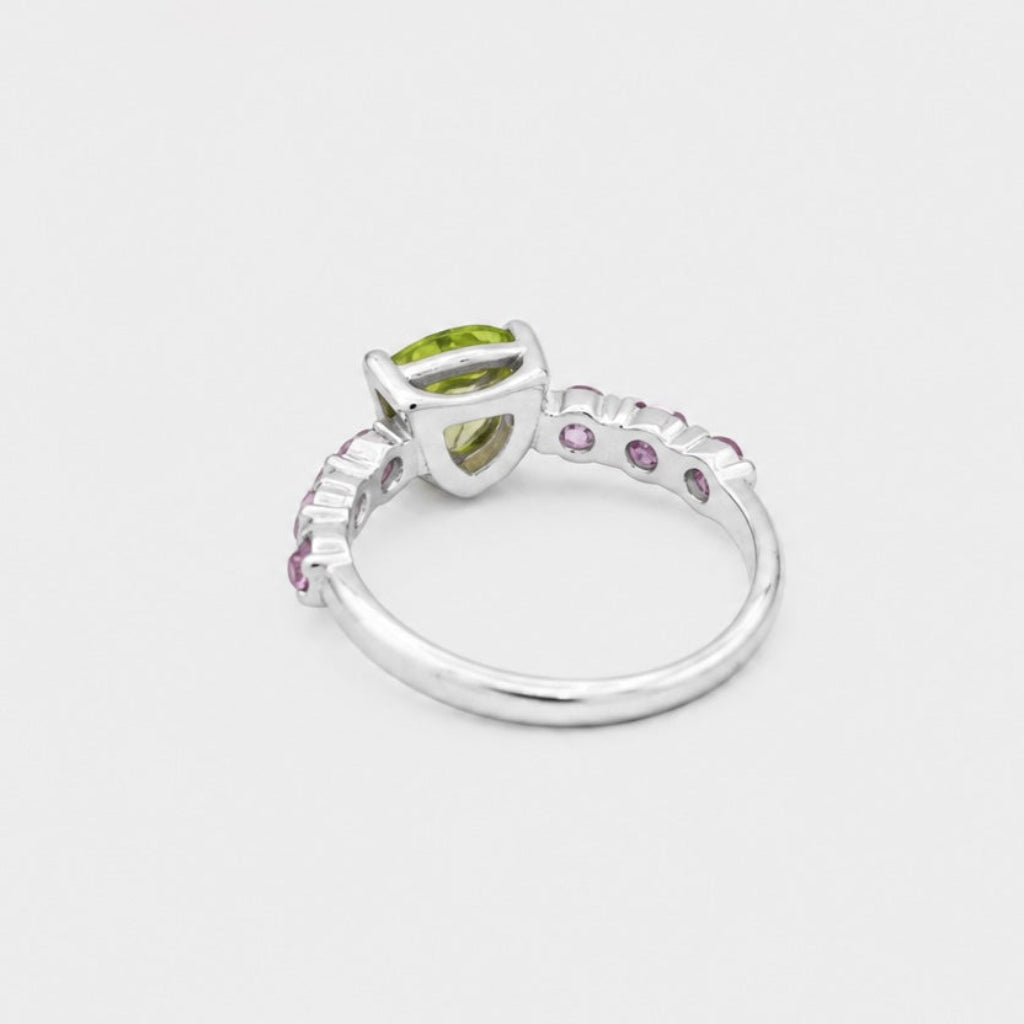 Silver ring with gemstones on a white background