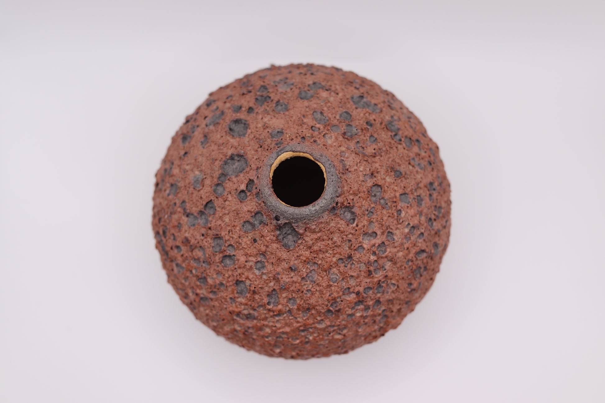Round abrasive disc with a central hole on a white background