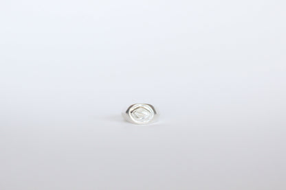 Silver ring on a white background