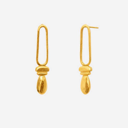 Pair of gold earrings on a white background