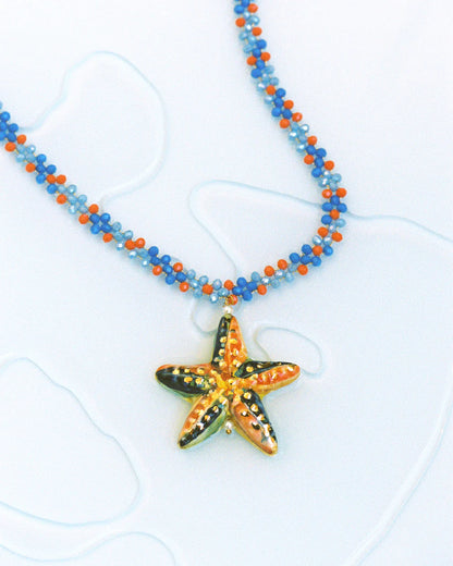 Necklace with a starfish pendant on a white background