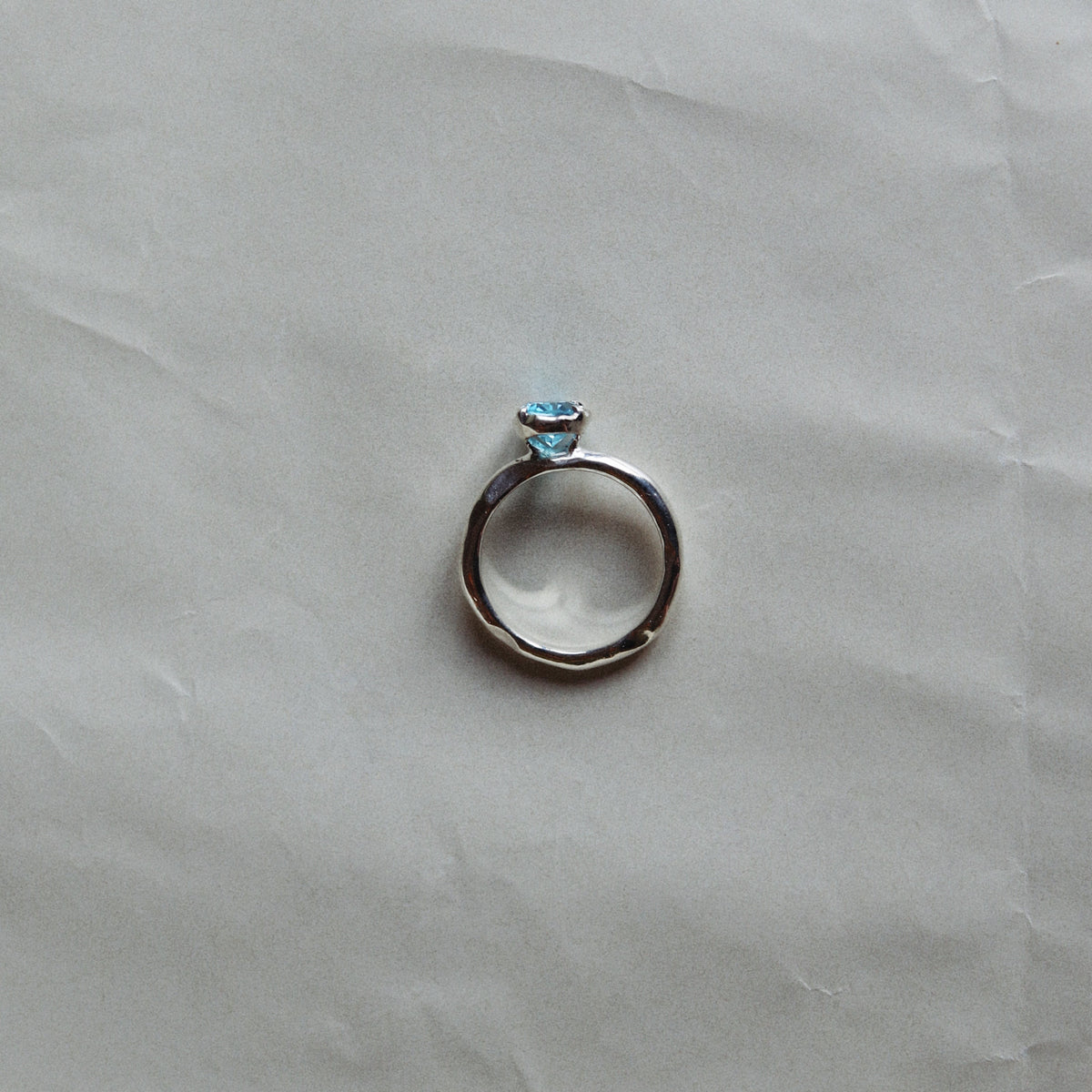 Silver ring with a blue gemstone