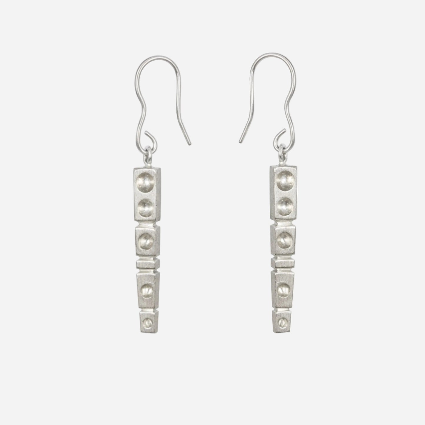 Pair of silver earrings on a white background