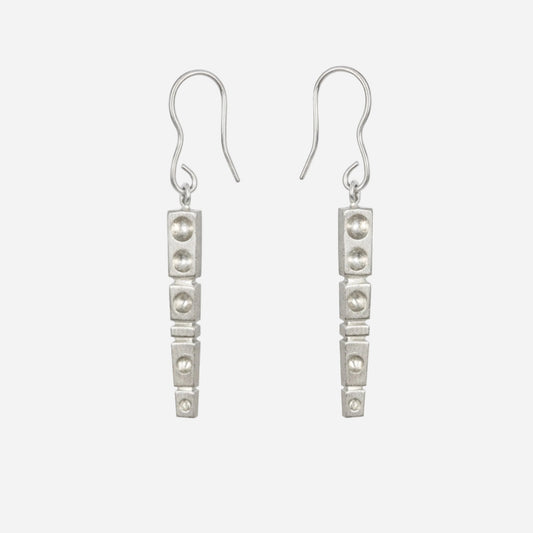 Pair of silver earrings on a white background