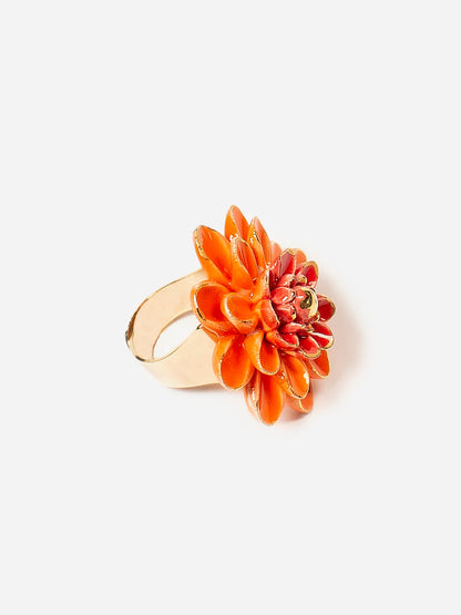 Orange floral ring with gold band on a white background