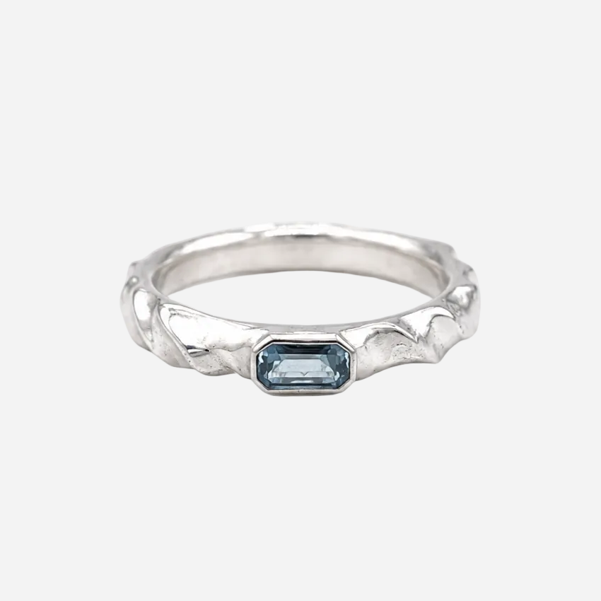 White rectangular object with a circular indentation on a white background