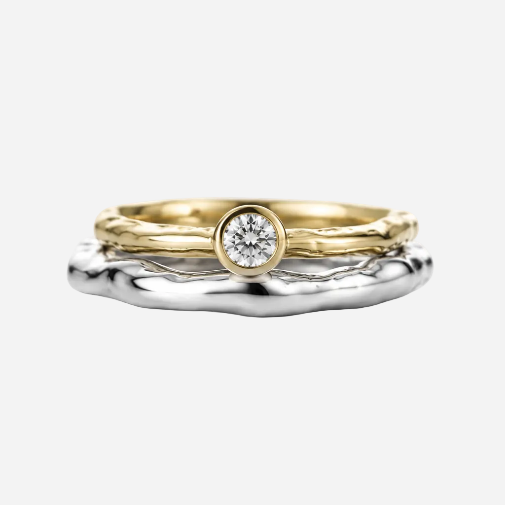 Two gold rings with diamond on a white background