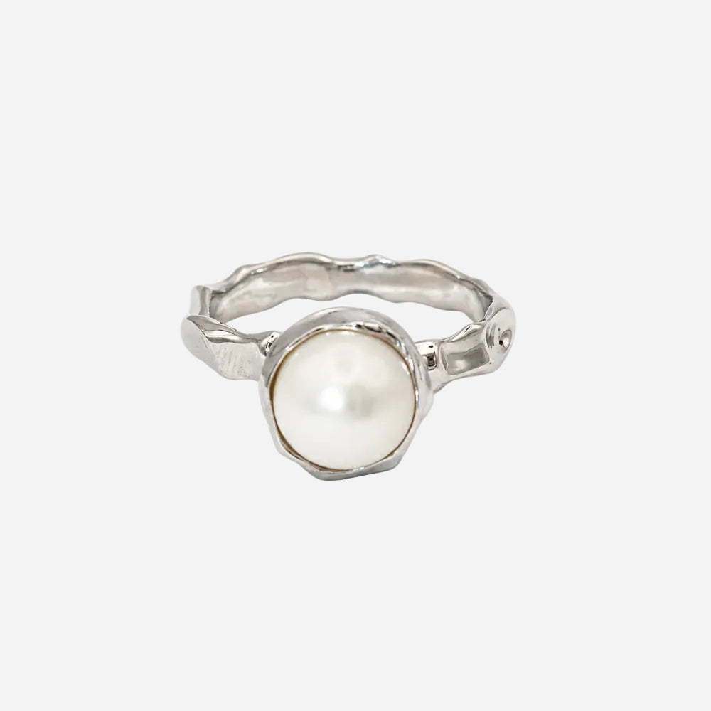 Silver ring with a pearl on a white background