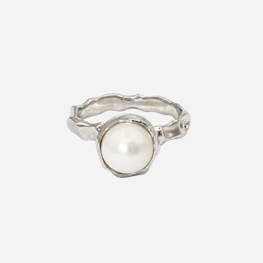 Silver ring with a pearl on a white background