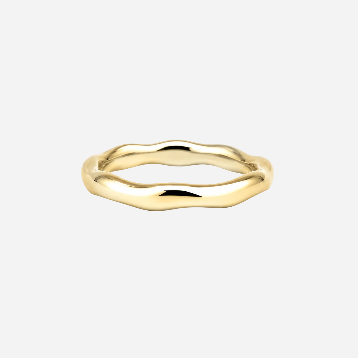 Gold ring with a wavy design on a white background