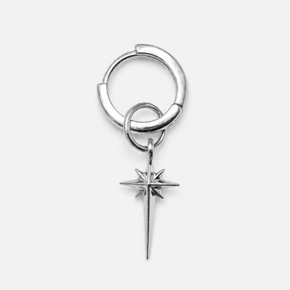 Silver hoop earring with a star-shaped charm on a white background
