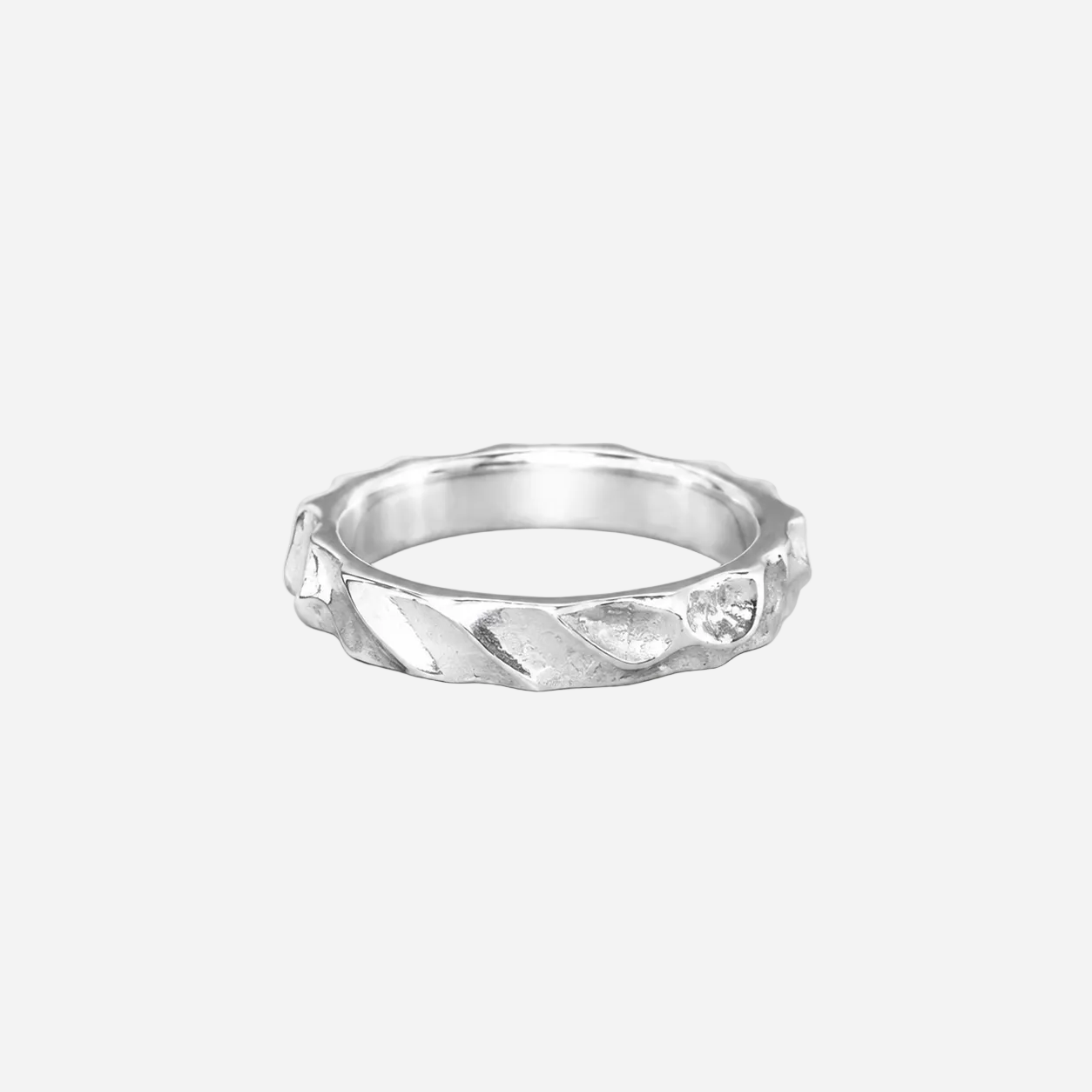Silver ring with a textured band on a white background
