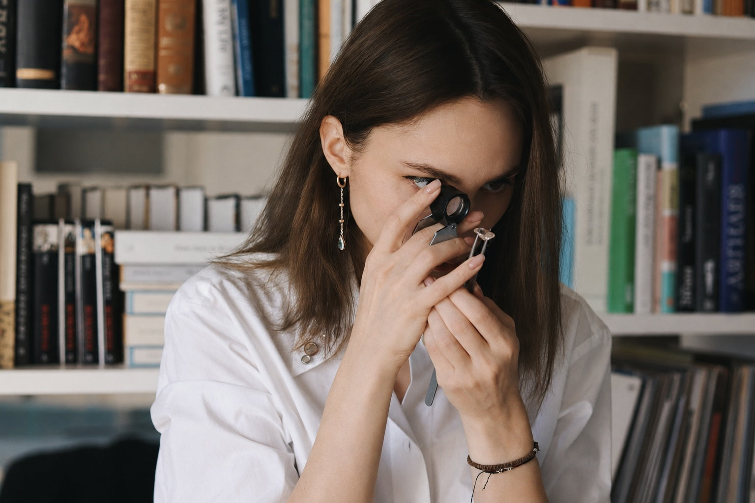 Eugenia examining a gemstone for Dune Workshop